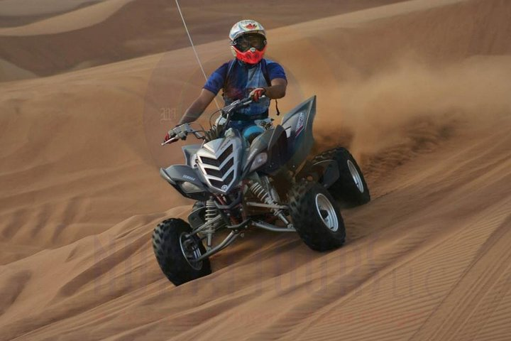 Dune Bashing with Quad Bike and Sand Boarding from Dubai - Photo 1 of 7